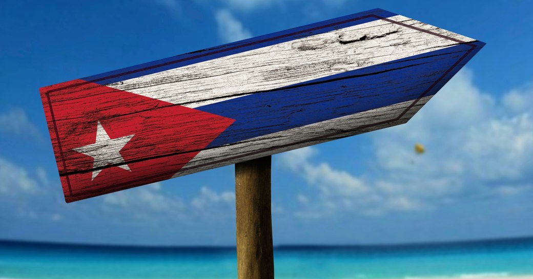 Sign post on beach, Cuba