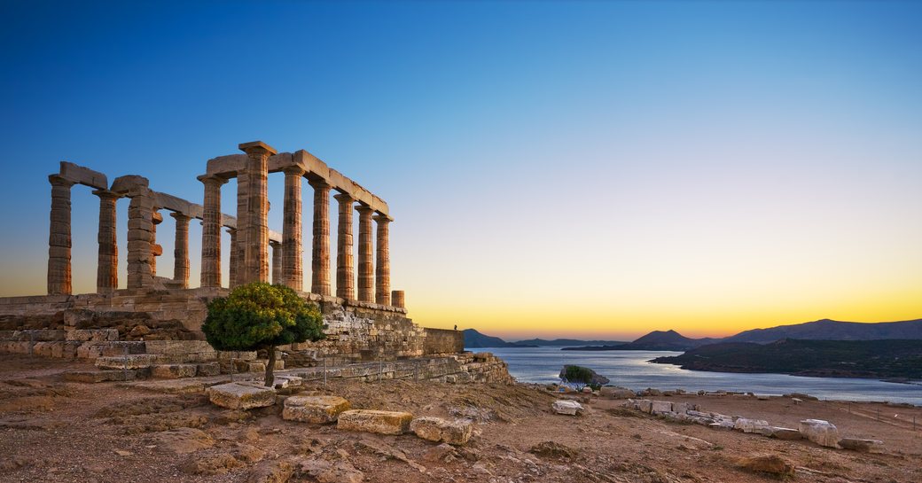 Ancient ruins at sunset in charter location greece