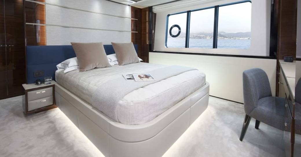 Master cabin onboard charter yacht ANKA, central berth with wide window adjacent