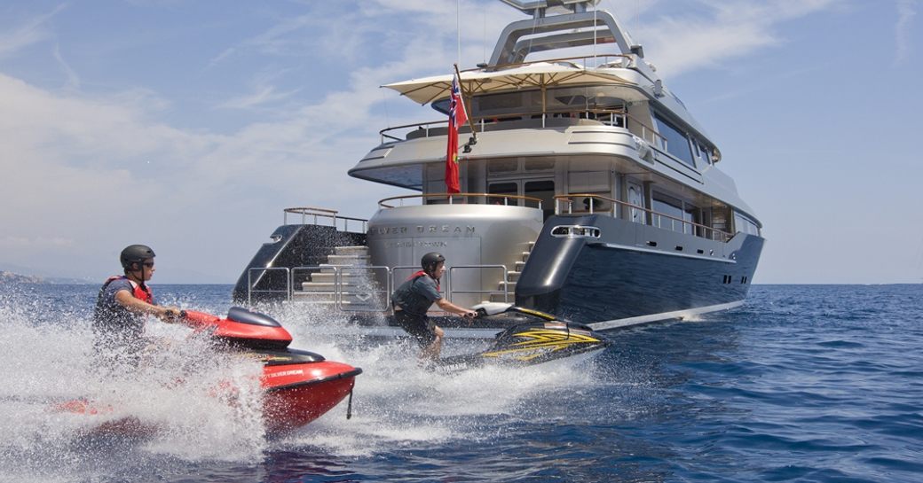 Jet skis to the stern of charter yacht SILVER DREAM