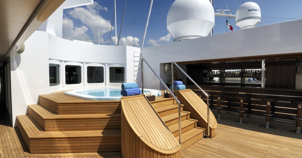 sundeck and jacuzzi on luxury yacht lauren l, with bar alongside