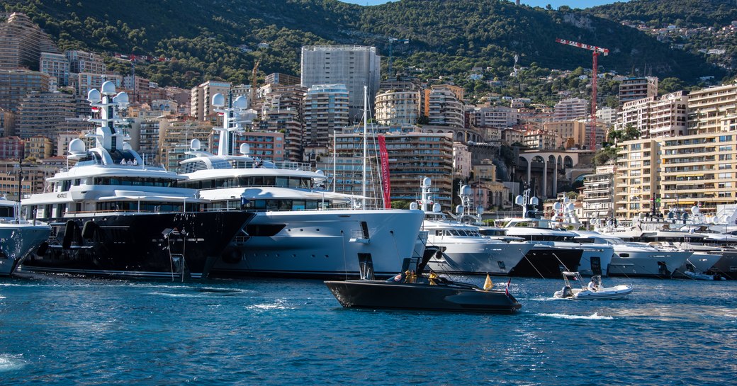 luxury yachts lined up at the Monaco Yacht Show 2022