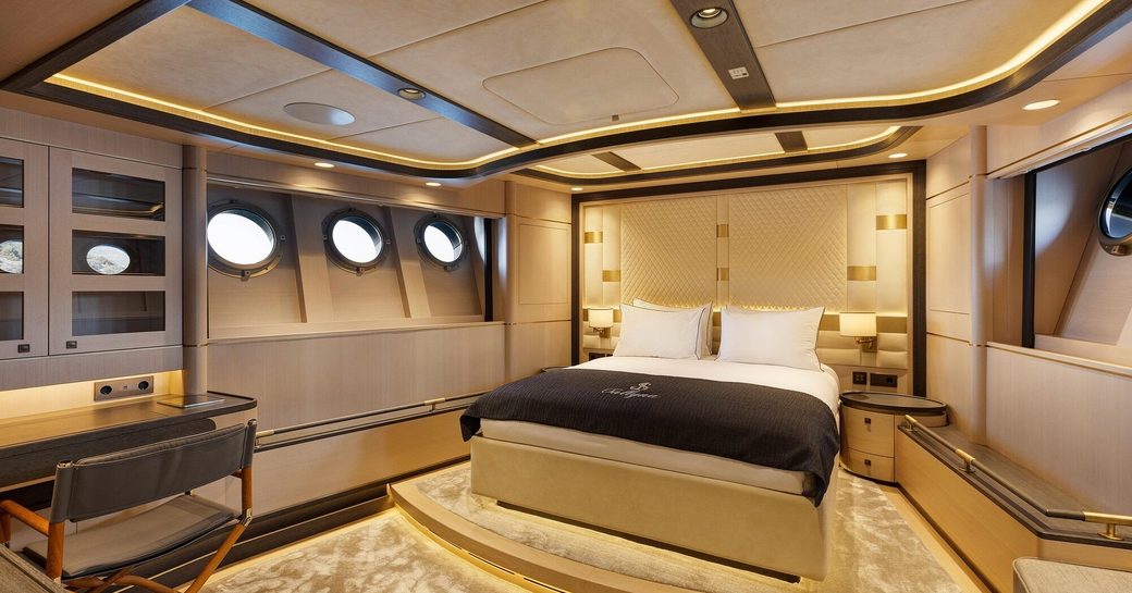 Master cabin onboard sailing yacht charter SALLYNA, central berth ans round porthole windows