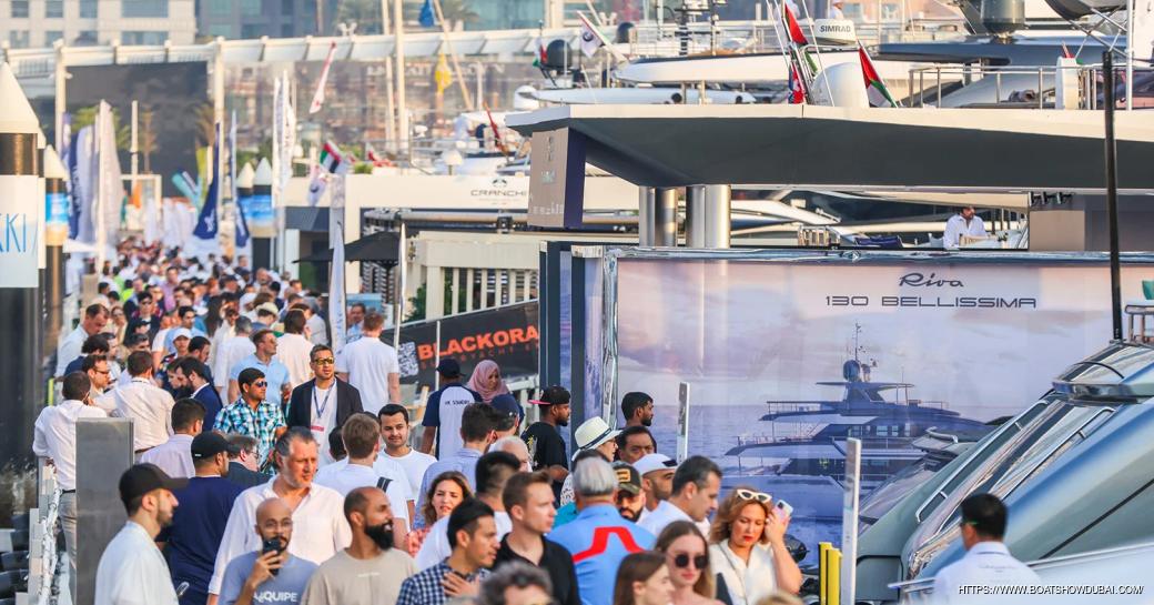 Many visitors walking along the docks at the Dubai International Boat Show