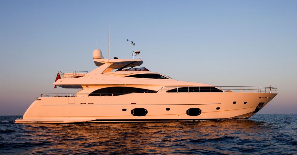 superyacht PERPETUAL anchored in the French Riviera on charter at sunset