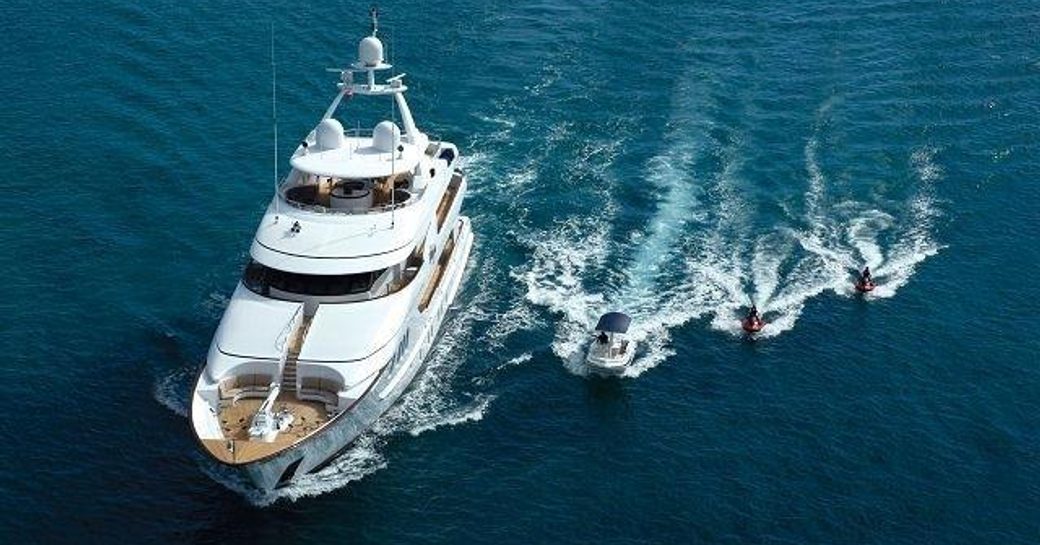 Superyacht ALLEGRIA underway with tenders