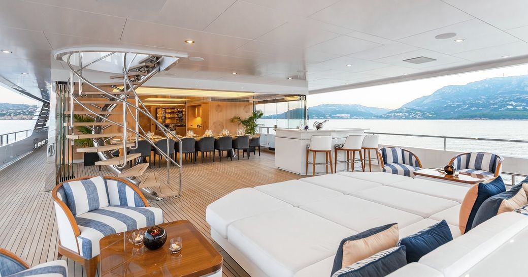 sunning station, bar and winter garden dining area on the aft deck of luxury yacht JOY