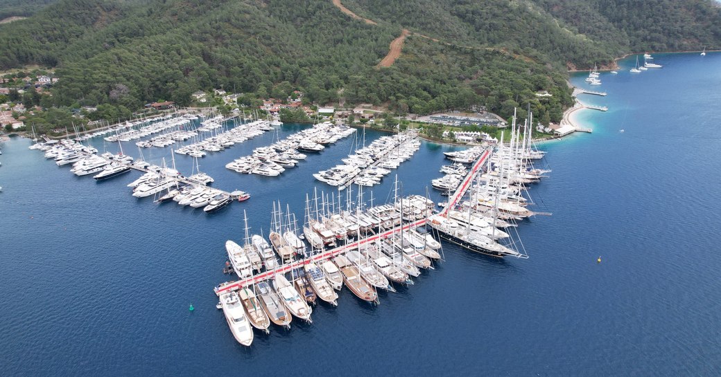 Aerial view looking down on Gocek D-Marin harbor with many luxury yacht charters berthed