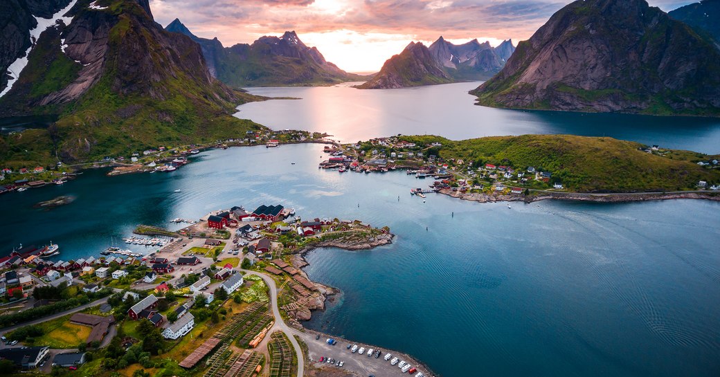 aerial shot of ocean and mountains in norway