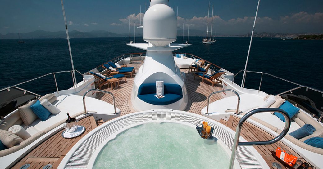 Jacuzzi and sun loungers on sun deck of superyacht Shake N Bake