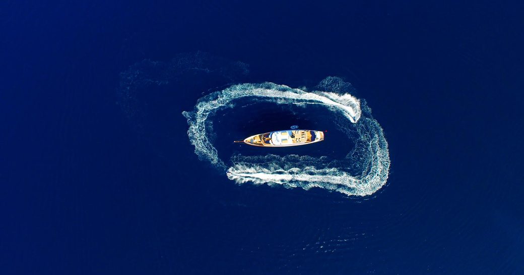 Aerial view of yacht clarity against blue water
