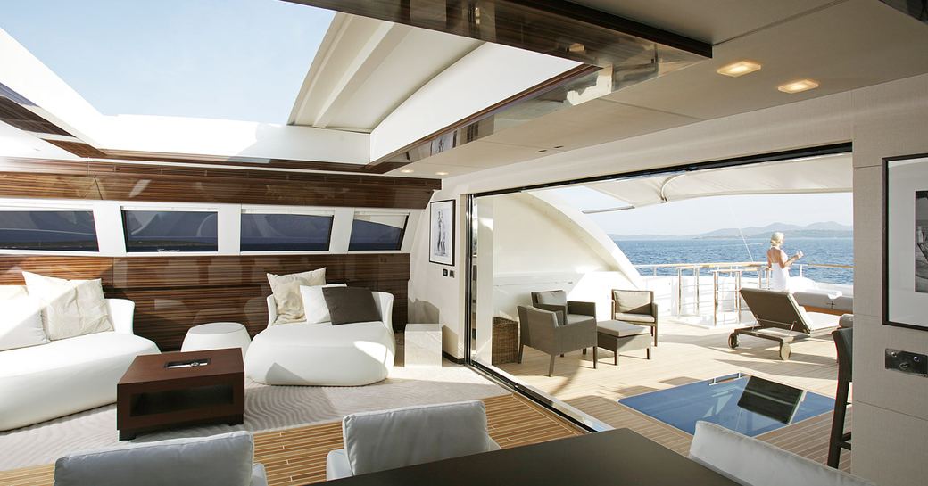Open plan interior of superyacht GEMS II, with view out to sea