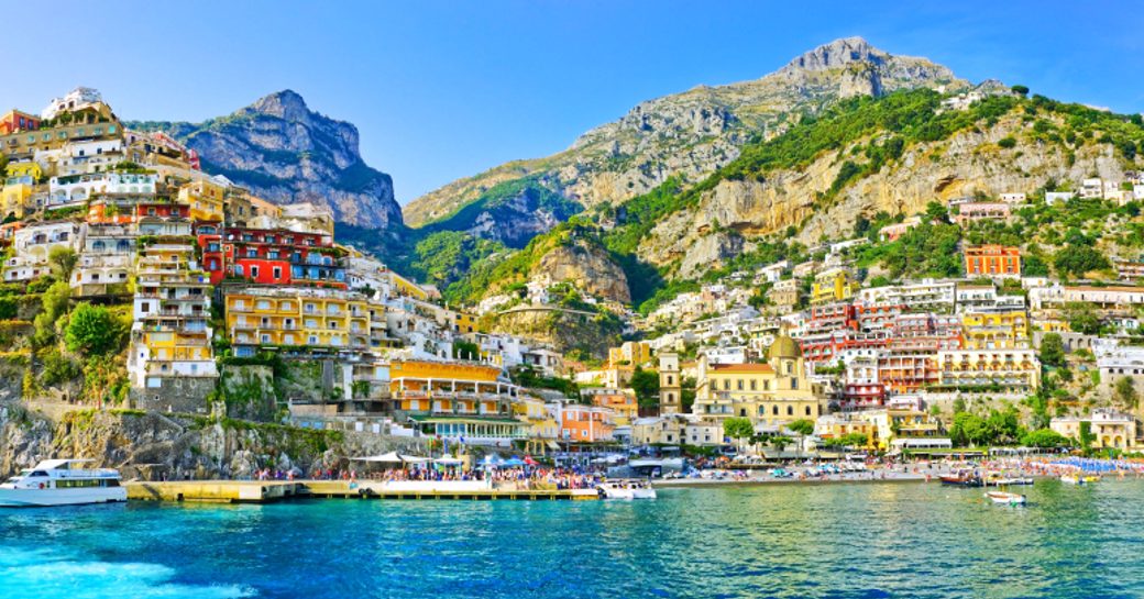 amalfi coast seascape, town of positano and pretty houses on the hills