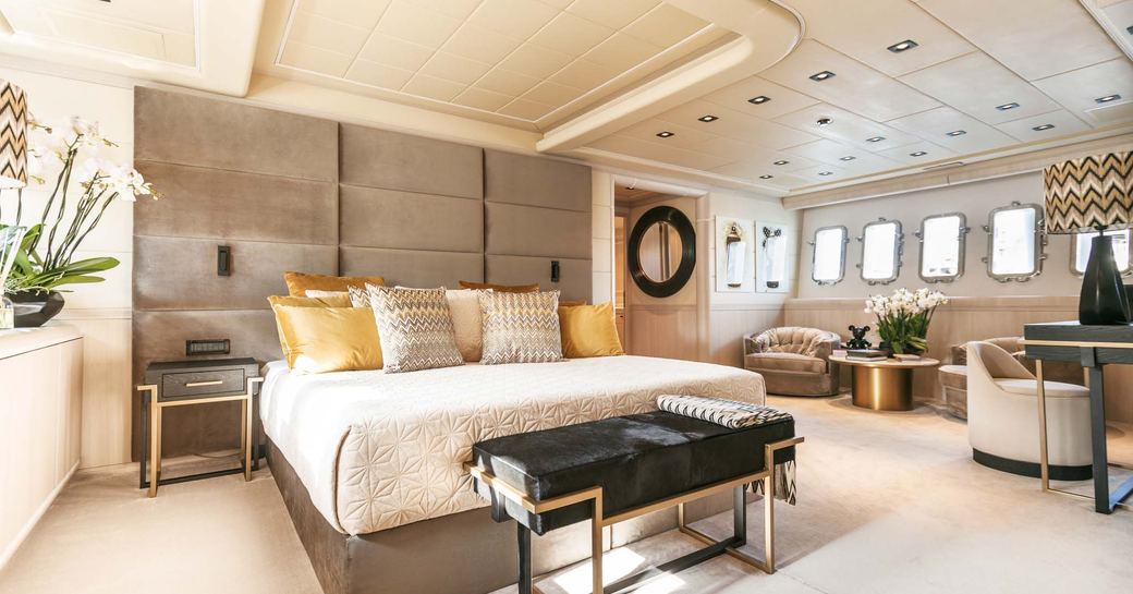 Master cabin onboard boat charter MRS GREY, central berth with seating area adjacent