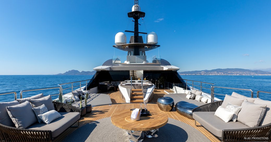 seating areas and spa pool on the sundeck of superyacht SOLO