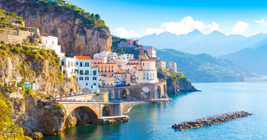 Morning view of Amalfi cityscape on coast line of mediterranean sea, Italy 
