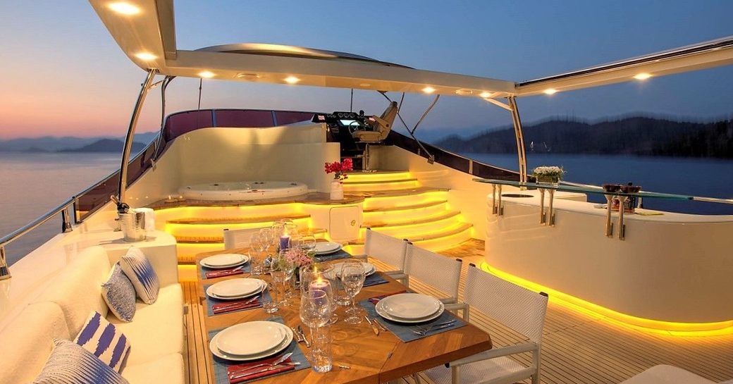 al fresco dining, bar and spa pool on the sundeck of motor yacht ARCHSEA 