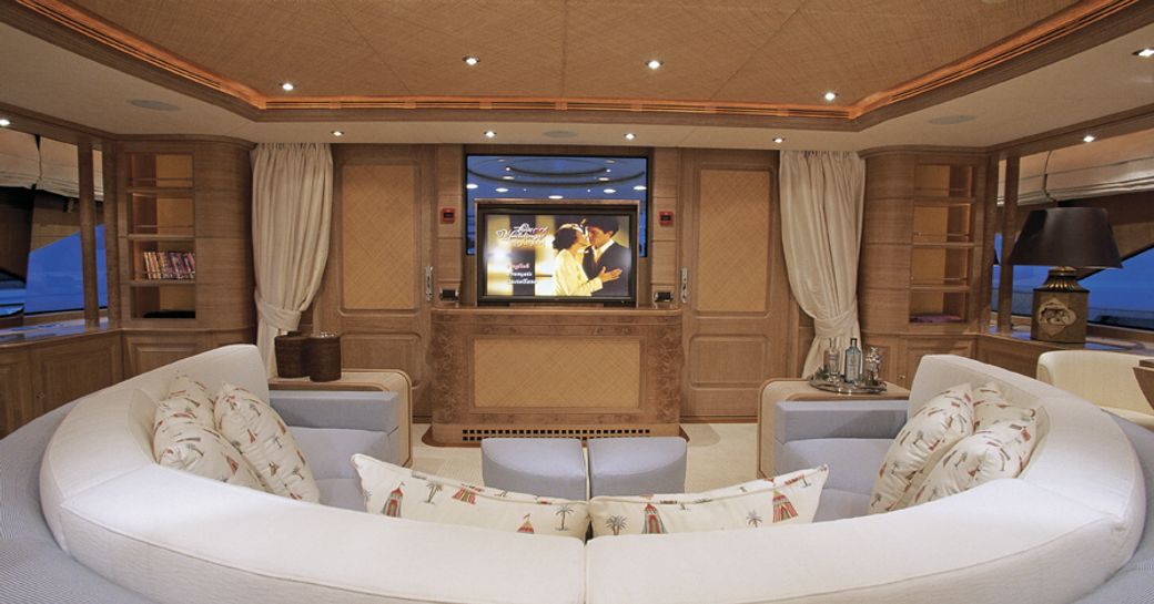 sofa seating around plasma screen TV in games room of luxury yacht JO