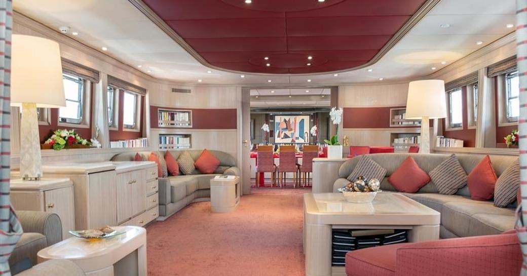 light and airy main salon with ample seating and pops of pink aboard superyacht ‘Cheetah Moon’ 