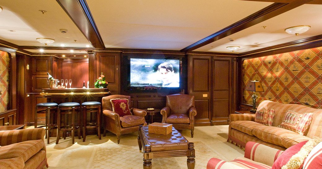 The main salon with furniture and TV on board superyacht TELEOST
