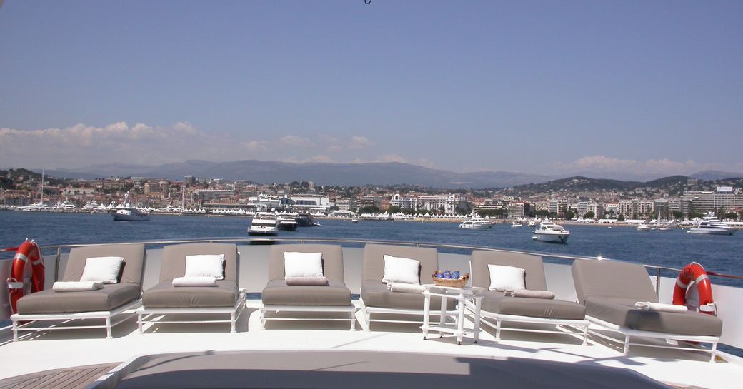 sun loungers lined up on sundeck of motor yacht Costa Magna