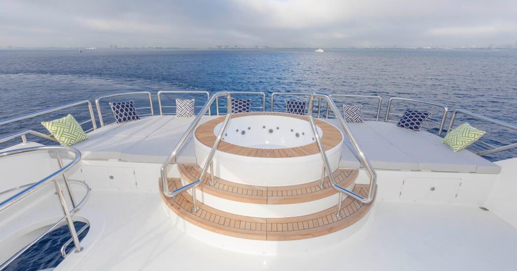 spa pool surrounded by sun pads on the sundeck of luxury yacht The Rock 