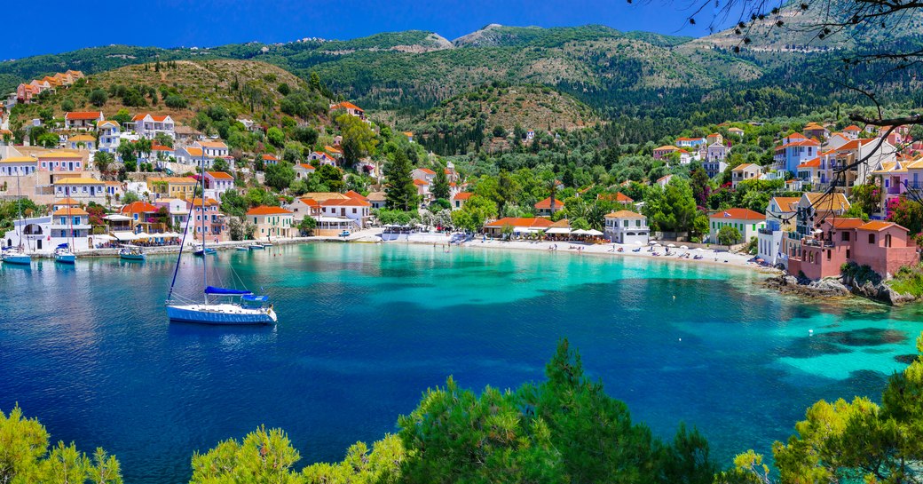 Beautiful Assos village, panoramic view, azure sea and traditional houses, Greece.