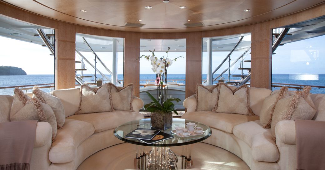 skylounge with curved sofas on board superyacht SUNRISE