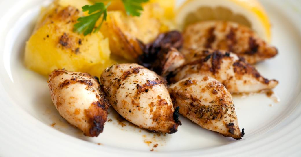 Delicious grilled squids with potatoes Greek style