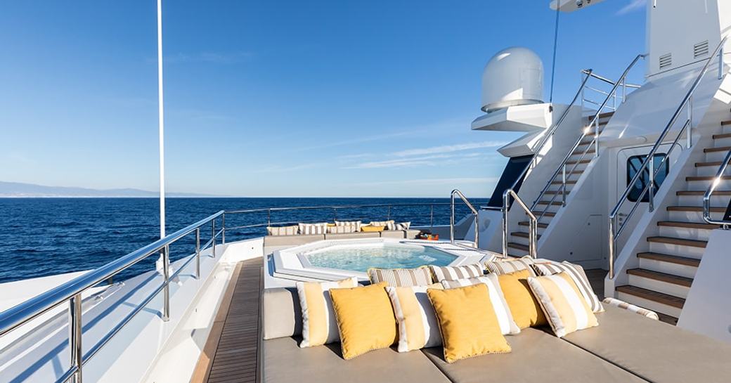 Overview of the deck Jacuzzi and sun pads onboard charter yacht LA DATCHA