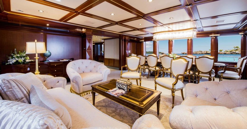 seating area and dining area in the main salon of charter yacht My Seanna