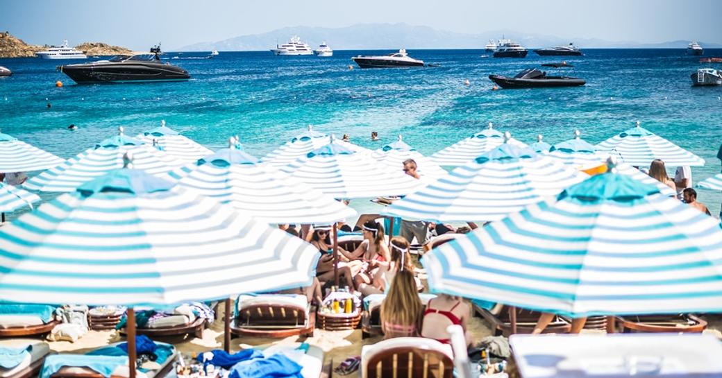Superyachts and sunbathers gathered at Nammos Beach Club
