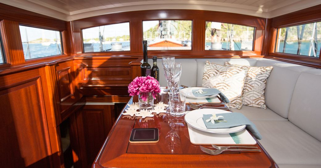 upper salon with sofa and table on board luxury yacht RAINBOW