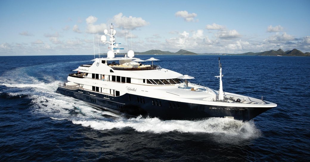 luxury yacht UNBRIDLED cuts through the water on a Mediterranean yacht charter
