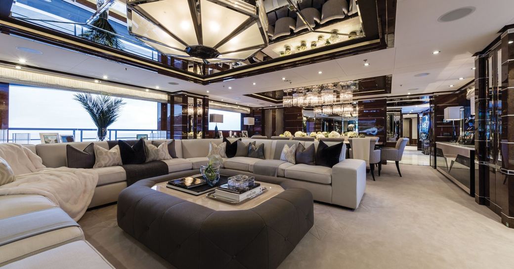 Art deco-themed main salon on board superyacht 11/11 with large U-Shaped sofa