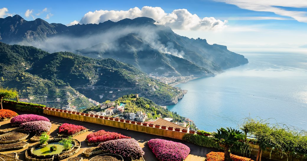 flowery gardens of ravello with mountains in background