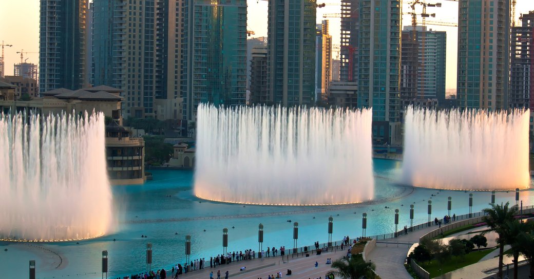Dubai Fountain on the ground level, beneath the Dubai skyline.