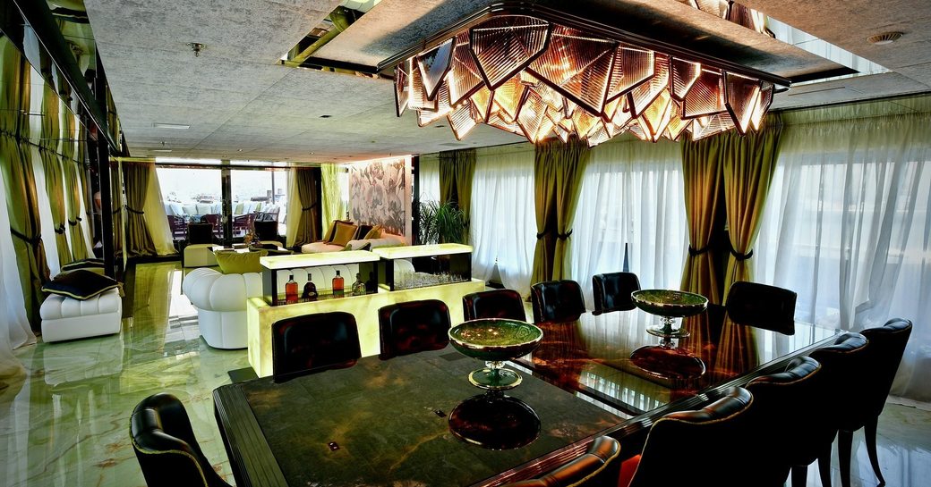 Superyacht sarastar main salon, with bronze light fixture
