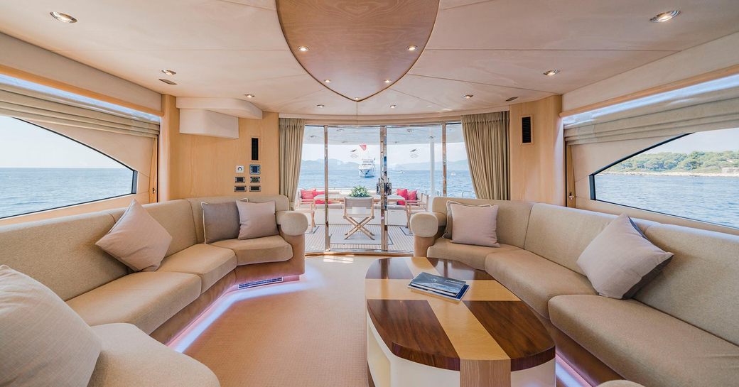 oak-clad main salon with large sofas and coffee table on board superyacht ‘Excelerate Z’ 