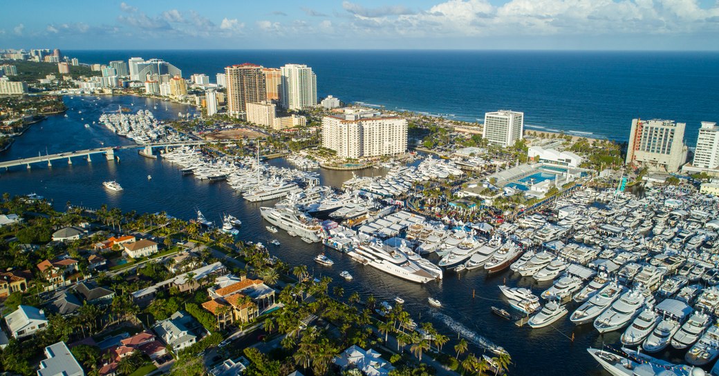 Aerial view of Fort Lauderdale during  FLIBS, hundreds of yachts berthed with sea in distance