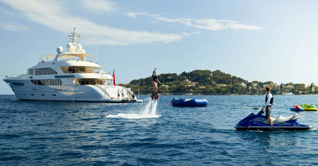 Guests enjoying the water toys on board charter yacht GHOST III