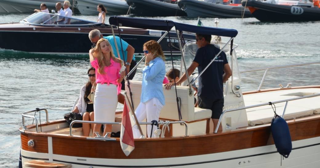 Clients on board a luxury water taxi at the Cannes Yachting Festival