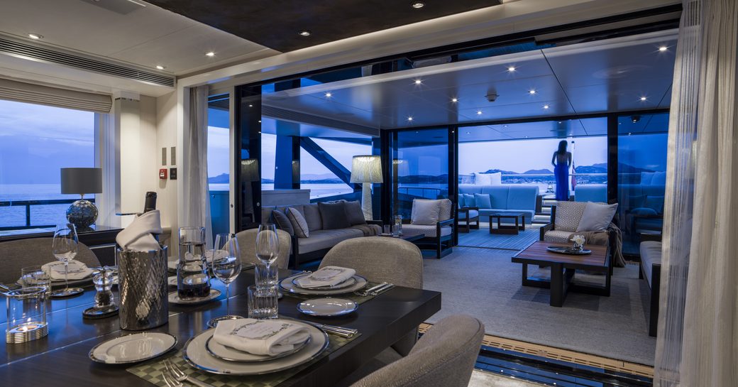 superyacht irisha by heesen main winter garden salon with dining and seating area in background