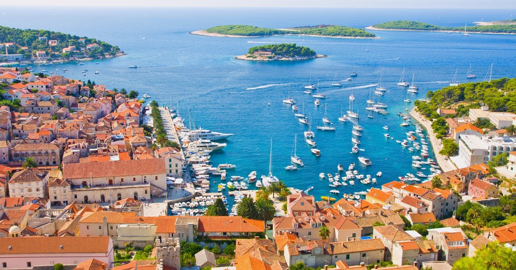 yachts line up in the port of Hvar Island in Croatia