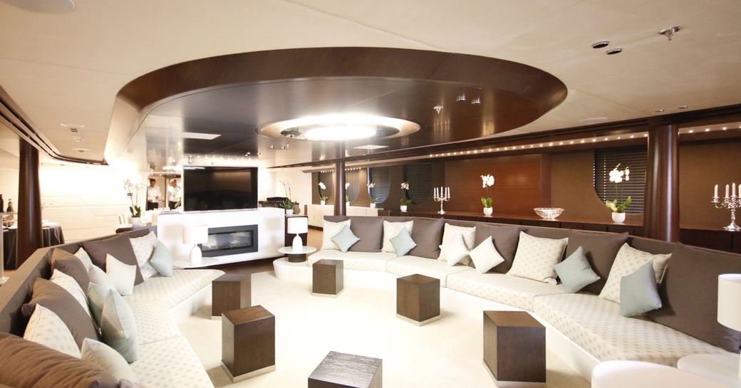 expansive main salon with large sofas and fireplace on board superyacht KATINA 