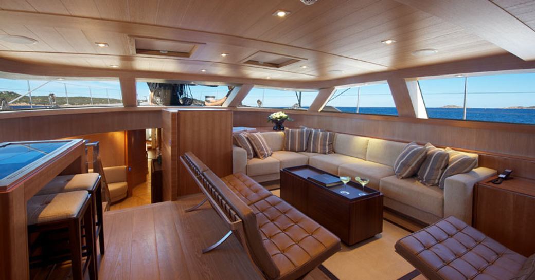 cosy main salon with expanse of windows on board sailing yacht SARISSA 