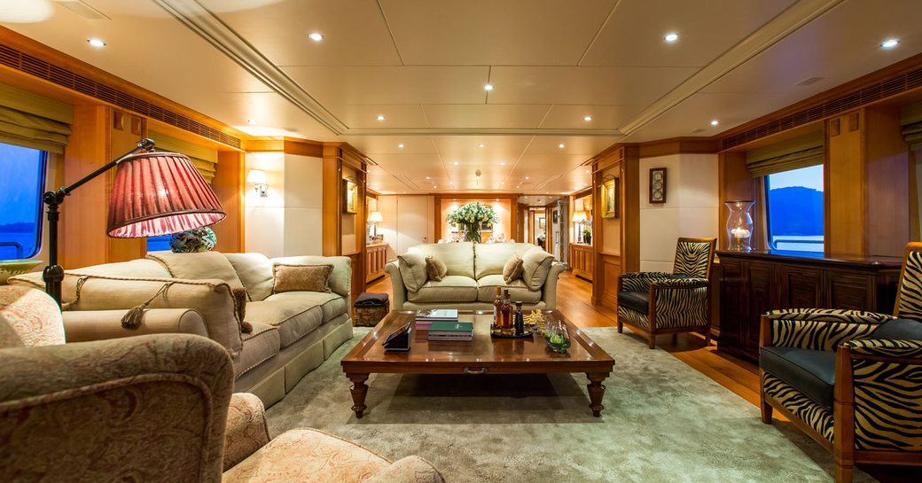 lounge with cherrywood panelling on board charter yacht ‘Seven Sins’ 