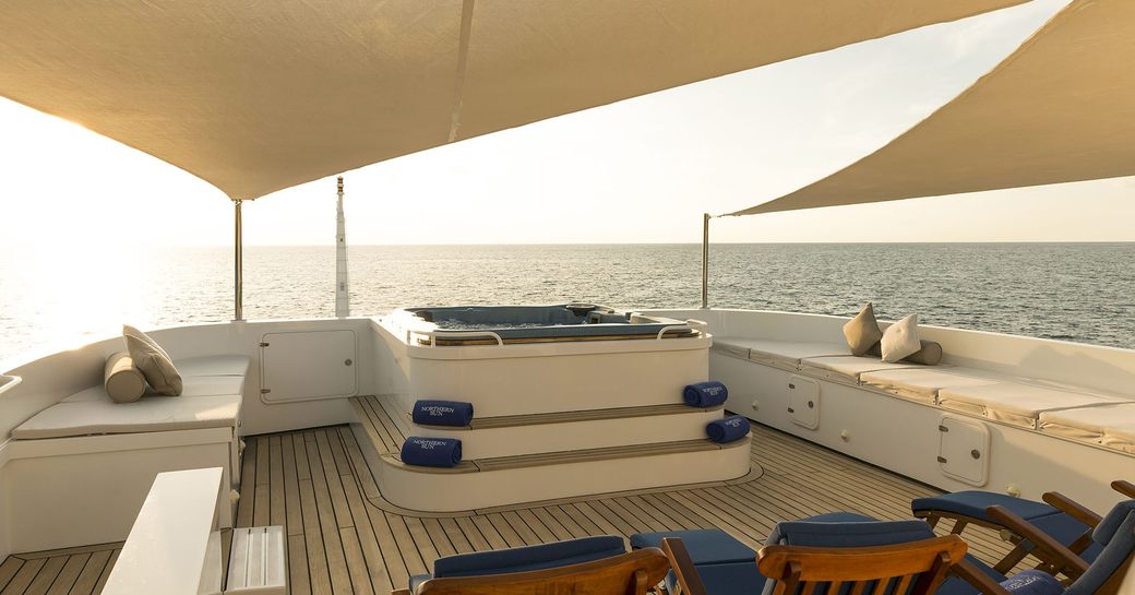 sun deck on superyacht northern sun with spa pool and sun pads