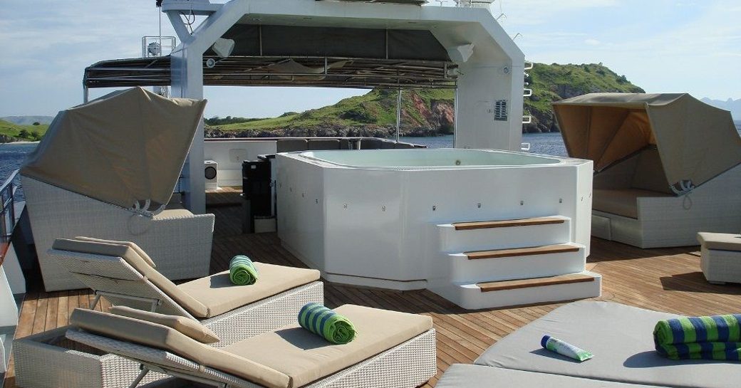 sundeck Jacuzzi surrounded by sunpads on board expedition yacht SALILA
