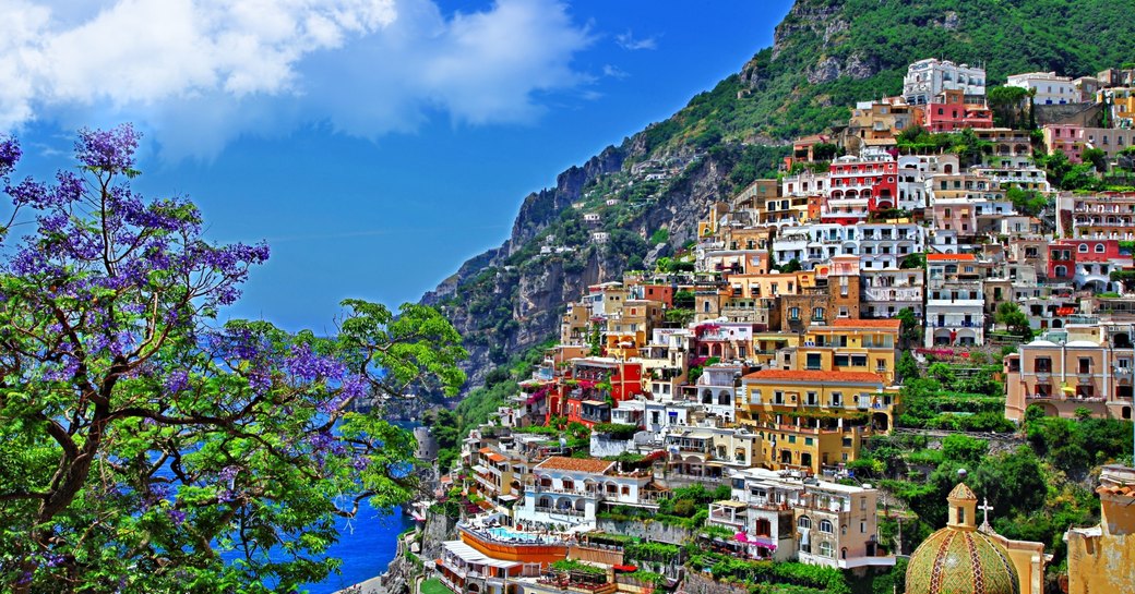 colourful buildings tumble down the hillside to the blue seas in Sorrento along the Amalfi Coast